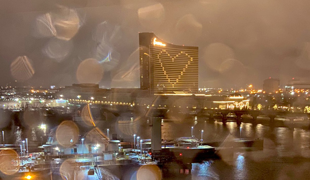 Encore Casino lit up like a heart in the rain