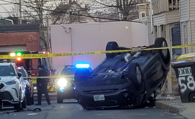 Car on its roof on Alston Street in Somerville