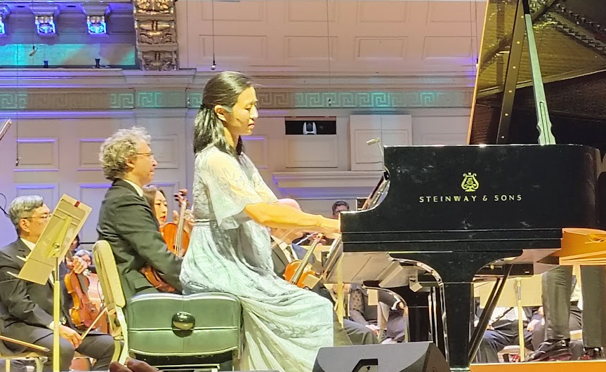 Michelle Wu playing the piano at Symphony Hall