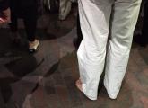 White pants and no shoes at Davis Square on the Red Line