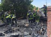 Firefighters on the roof of 57 W. 7 St. in South Boston