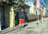 Guy in shorts on coldest day in a long time in Union Square.