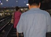 Passengers walking on Orange Line tracks