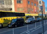 Long line of yellow shuttle buses