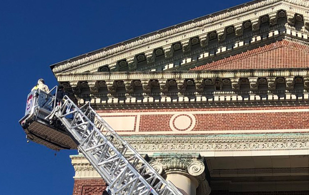 Inspecting the roof line of the church